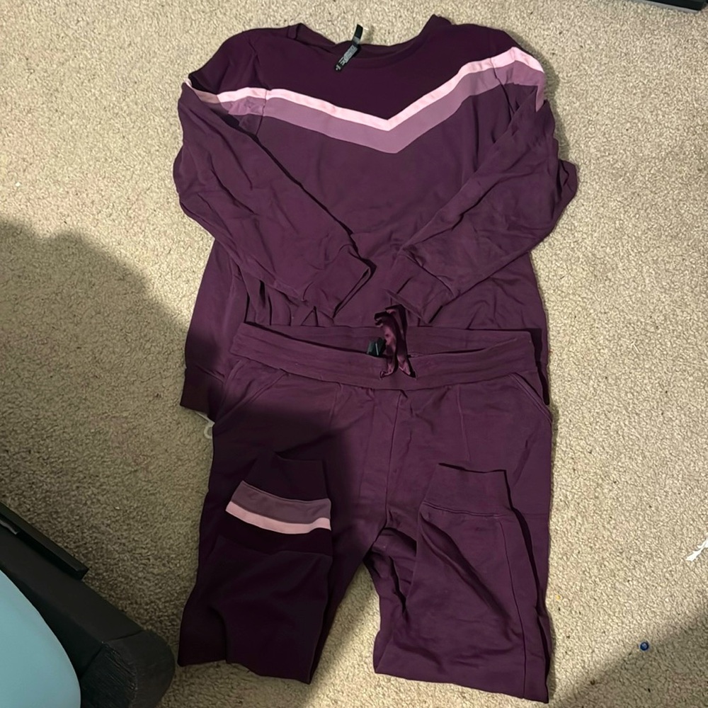 Purple torrid track suit.